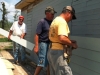 21 Team from Augusta,GA putting hardy plank siding on Ms. Reba's shed.